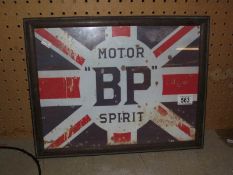 A retro BP motor spirit sign in old frame.
