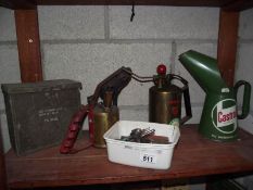 An original Castrol oil jug, a brass blowgun, garden sprayer etc.