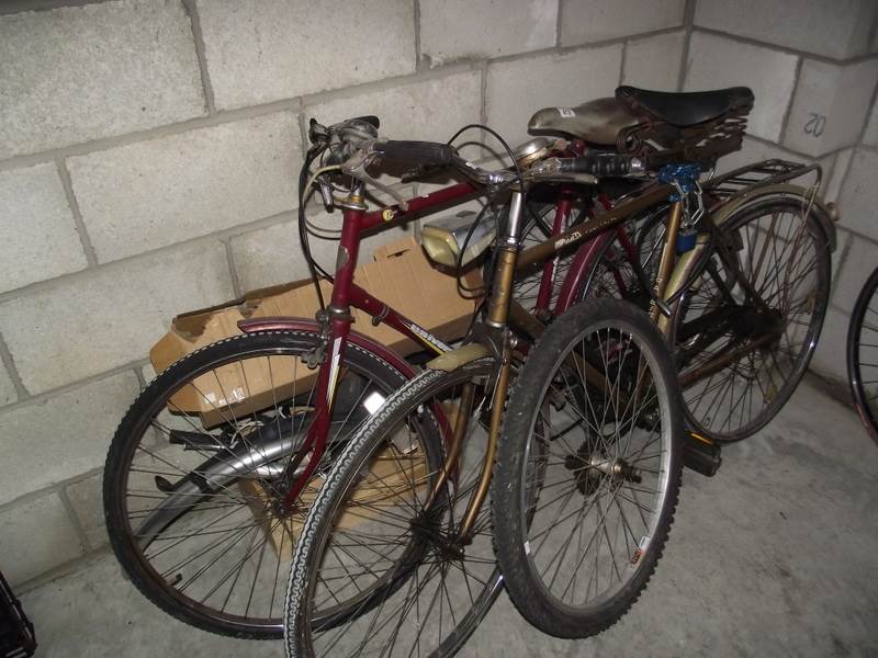 2 old bicycles for spares or repair and a box of parts.