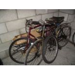 2 old bicycles for spares or repair and a box of parts.