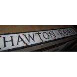 A pressed aluminium 'Hawton Road' street sign.