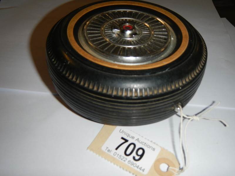 A vintage transistor radio in the form of a wheel, made in Japan.