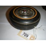 A vintage transistor radio in the form of a wheel, made in Japan.