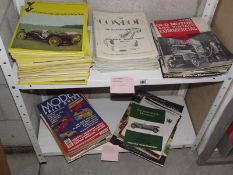 2 shelves of magazines, posters and manuals relatind to vintage cars, some Rolls Royce etc,