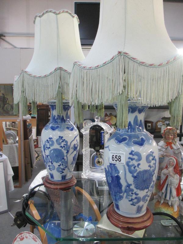 Two blue and white Oriental style lamps with shades