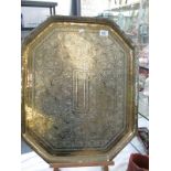 A large brass tray with Islamic design