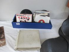 A collection of single 45 rpm single records including Madness