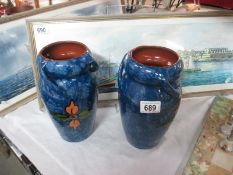 A pair of painted vases