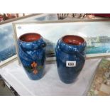 A pair of painted vases