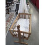 A swing cot / cradle