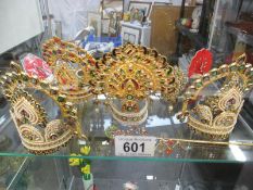 A collection of miniature Indian tiaras and headwear