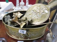 A collection of brass items including foot bath and bellows