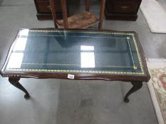 A glass topped coffee table