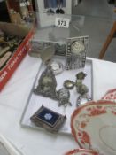 A collection of small silverplate frames and other items