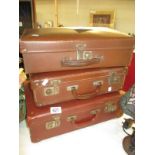 Three old brown cases