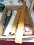 A collection of vintage rulers and measuring items