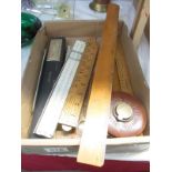 A collection of vintage rulers and measuring items