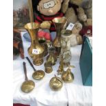 A collection of brass vases,