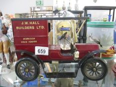 A small model of a vintage van sign written saying J W Hall Builders Ltd