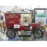 A small model of a vintage van sign written saying J W Hall Builders Ltd