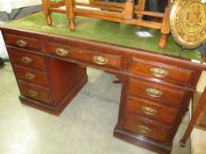 An old leather topped writing desk