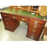 An old leather topped writing desk