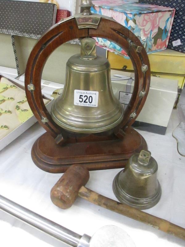 A bell on stand with knocker and small bell