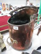 A large copper coal scuttle