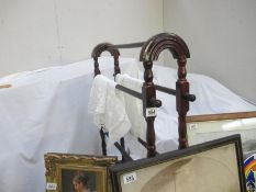 A vintage style wooden towel rack