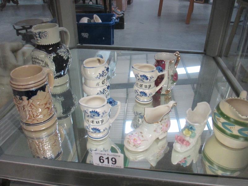 A shelf small pottery items