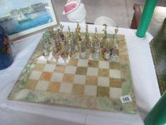 A chess set on marble style board