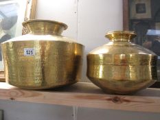 Two brass spitoons - a larger and small example