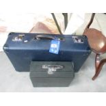A vintage suitcase and another case