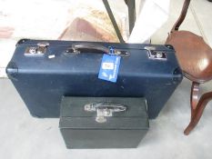 A vintage suitcase and another case