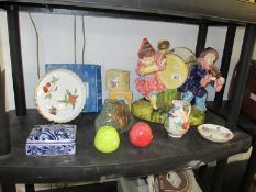 A shelf of pottery,