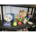 A shelf of pottery,