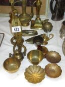 A collection of brassware items including Cobra