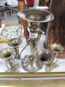 A large silver plate epergne and two smaller epergnes