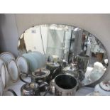 An oval wall mirror