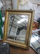 A framed rectangular mirror