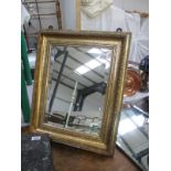 A framed rectangular mirror