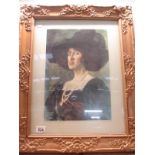 An ornate framed print of a lady