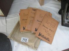 A collection of old photo packets and negatives