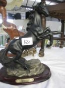 A figurine of a black horse