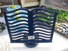A blue metal cook book stand