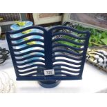 A blue metal cook book stand