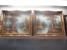 Two gilt framed oil on canvase woodland scenes signed but indistinct