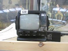 A vintage Steepletone black and white portable television receiver