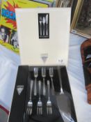 A boxed set of Viners Blue Nordic forks etc