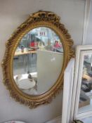 An ornate gilt framed mirror